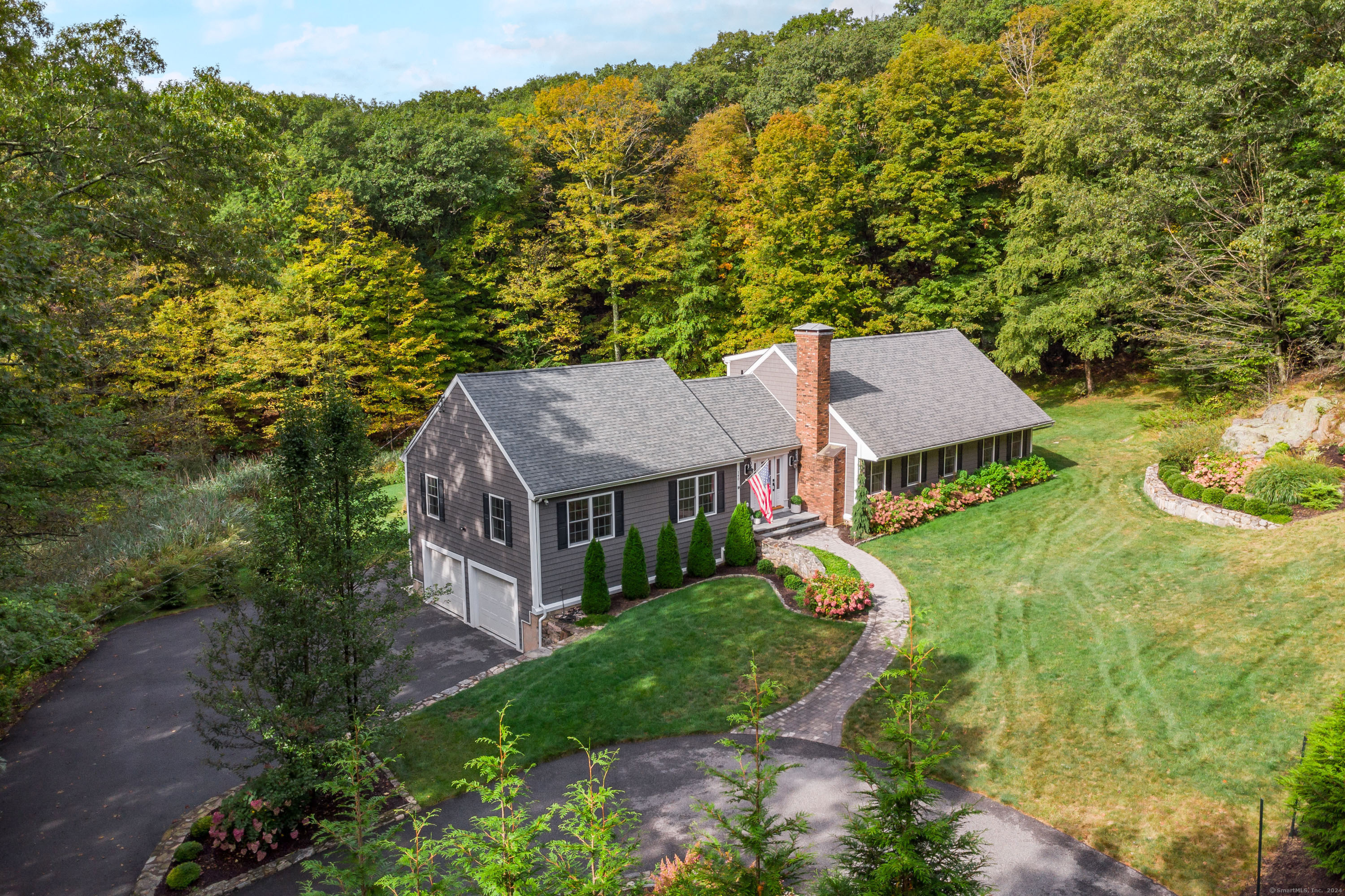 an aerial view of a house with a yard