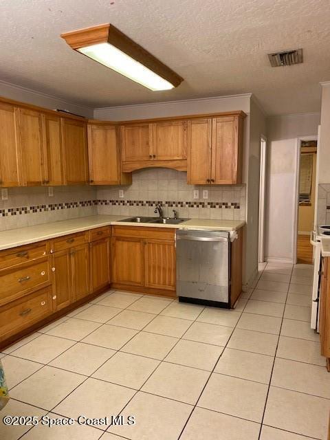 a kitchen with stainless steel appliances a stove a sink a microwave and cabinets