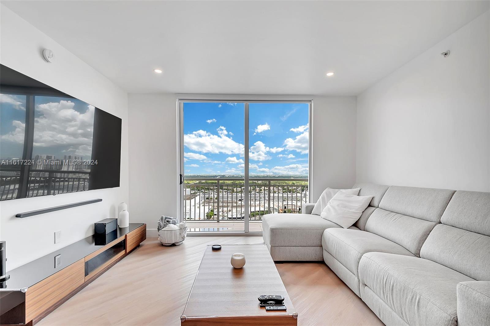 a living room with furniture and a flat screen tv