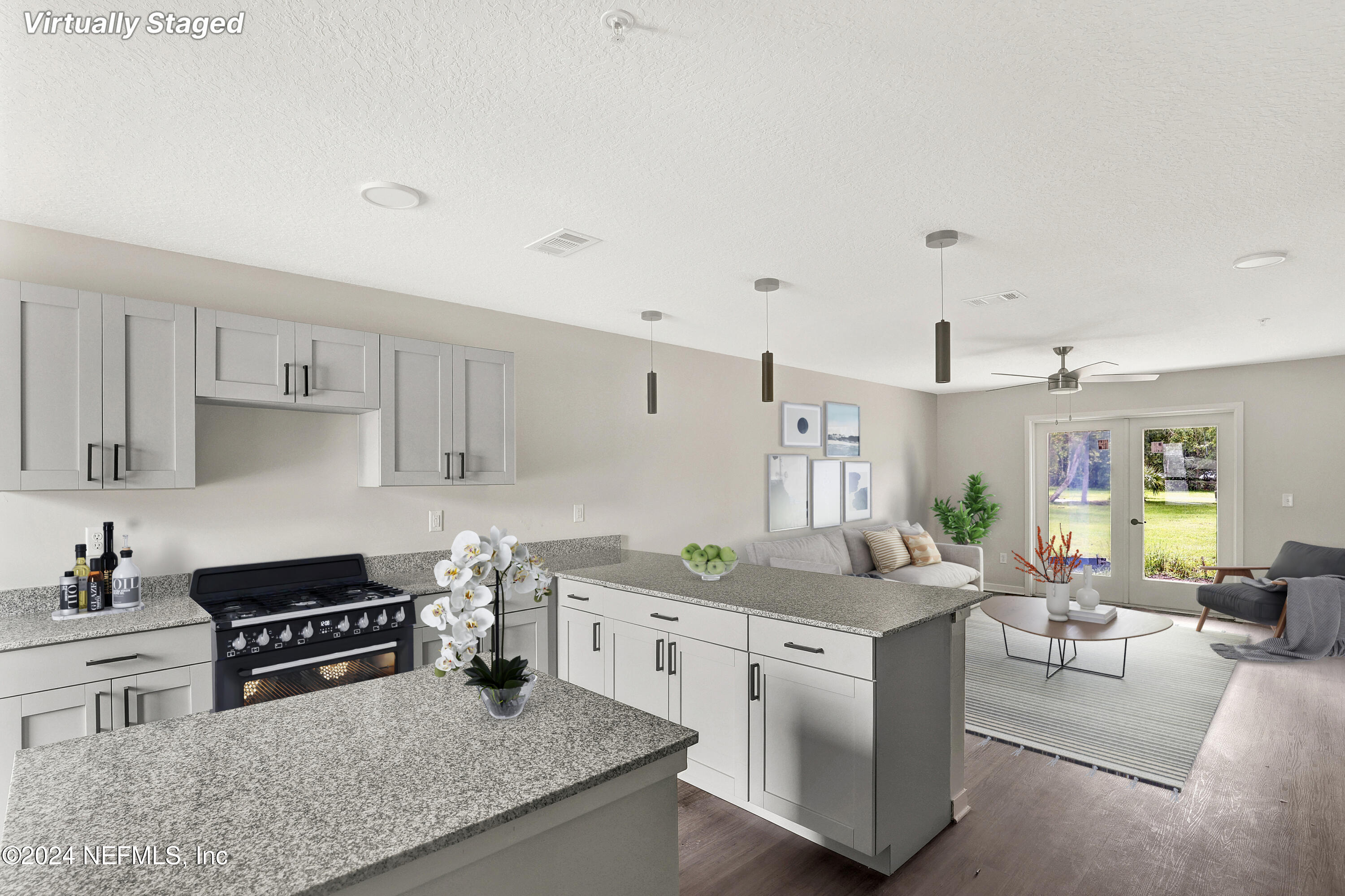 a kitchen with stainless steel appliances granite countertop a stove and cabinets