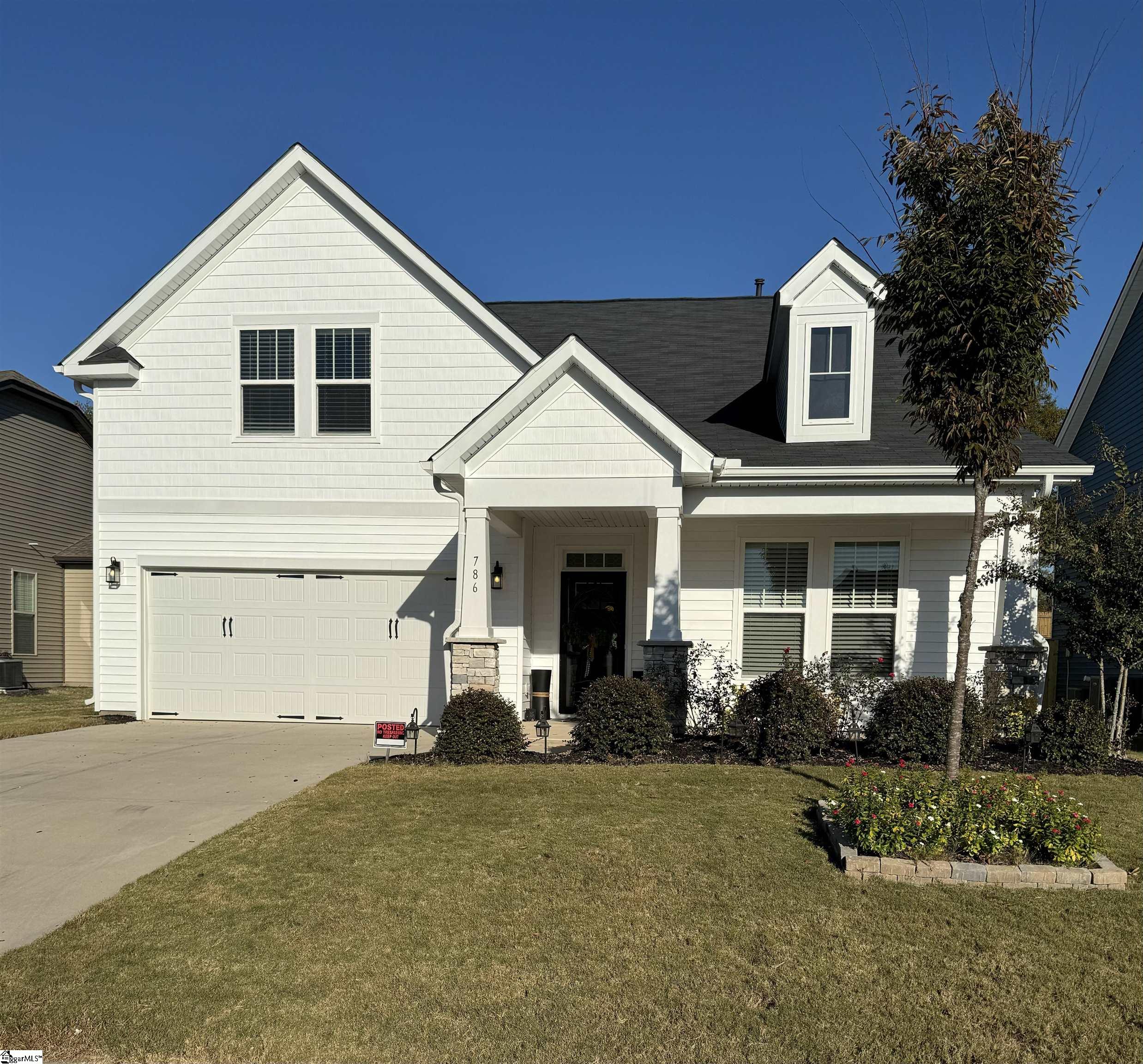 DRB Cooper 3 home, with white vinyl siding, white shaker accent, Artic  White trim color, and a black Composite shingle roof.