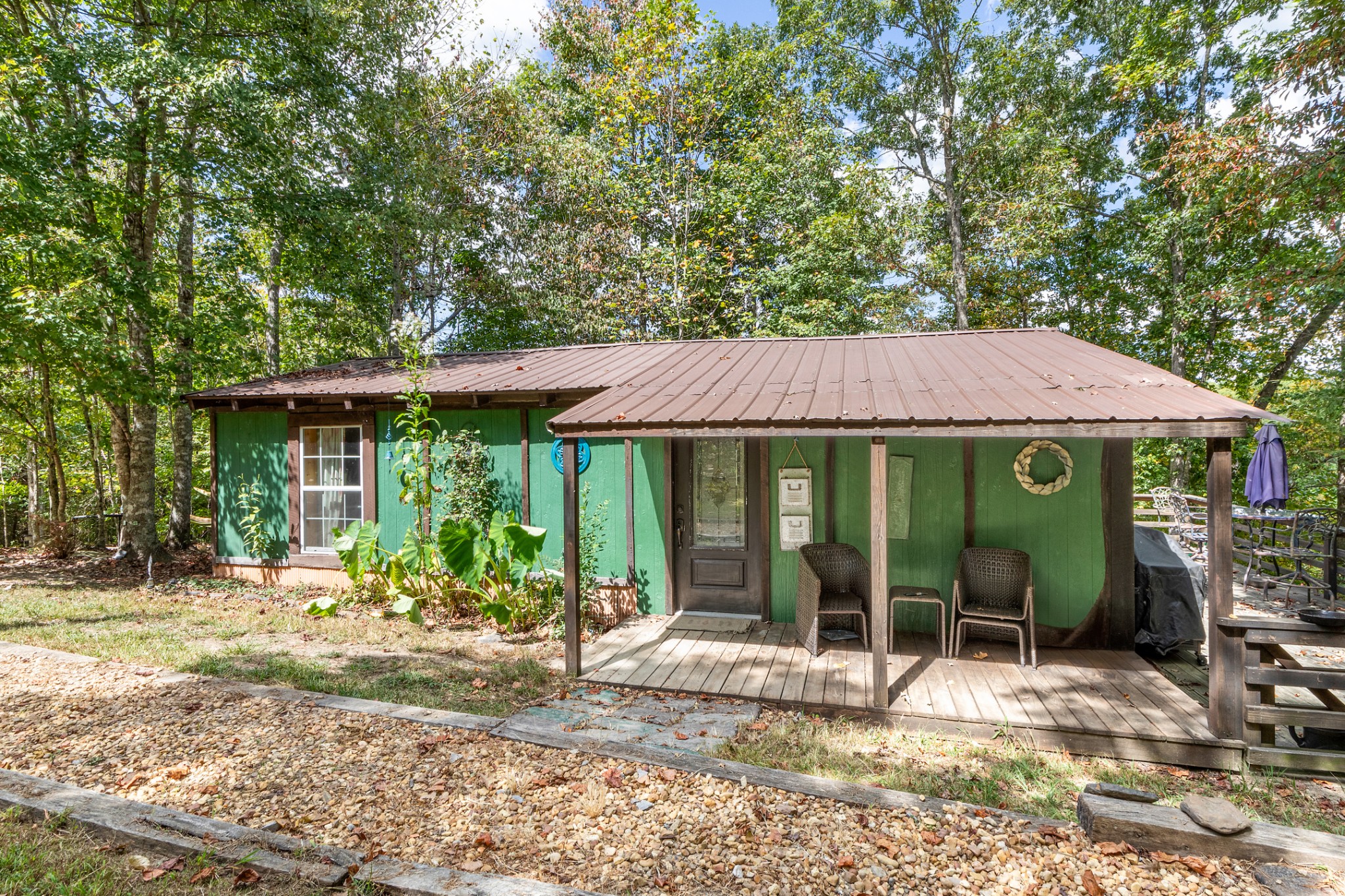 a view of a house with backyard porch and sitting area