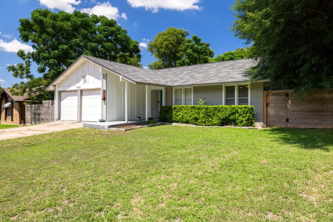 a house view with a garden space