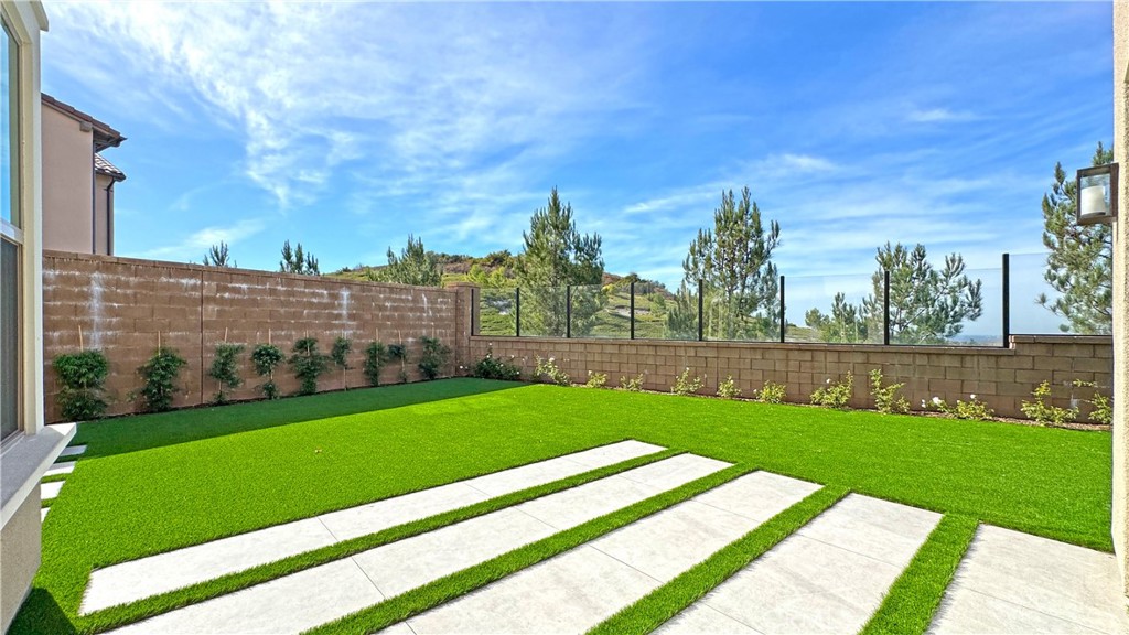 a view of a backyard with large trees