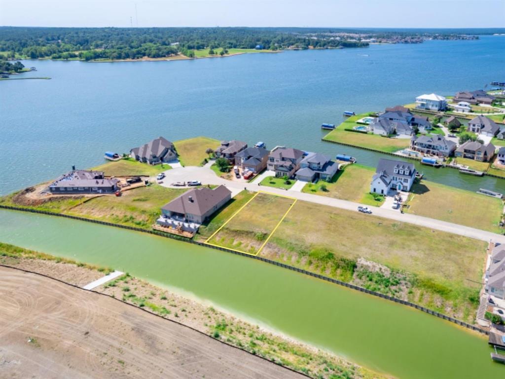 a front view of a house with a lake view