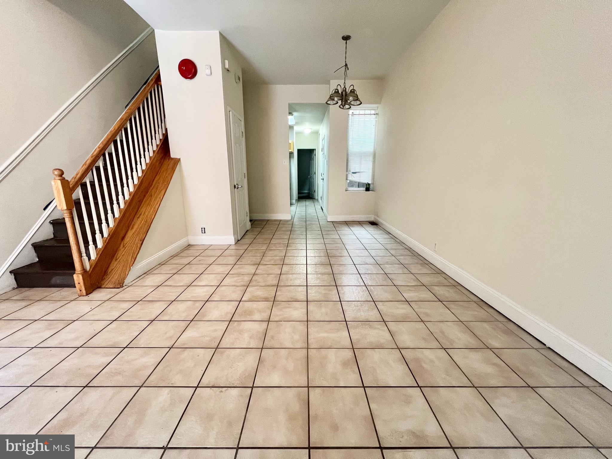 a view of a hallway and wooden floor