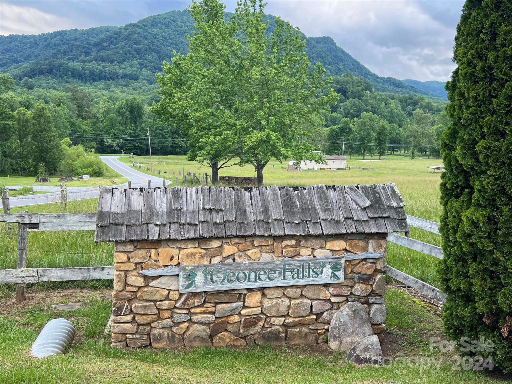 a wooden bench sitting in the middle of a park