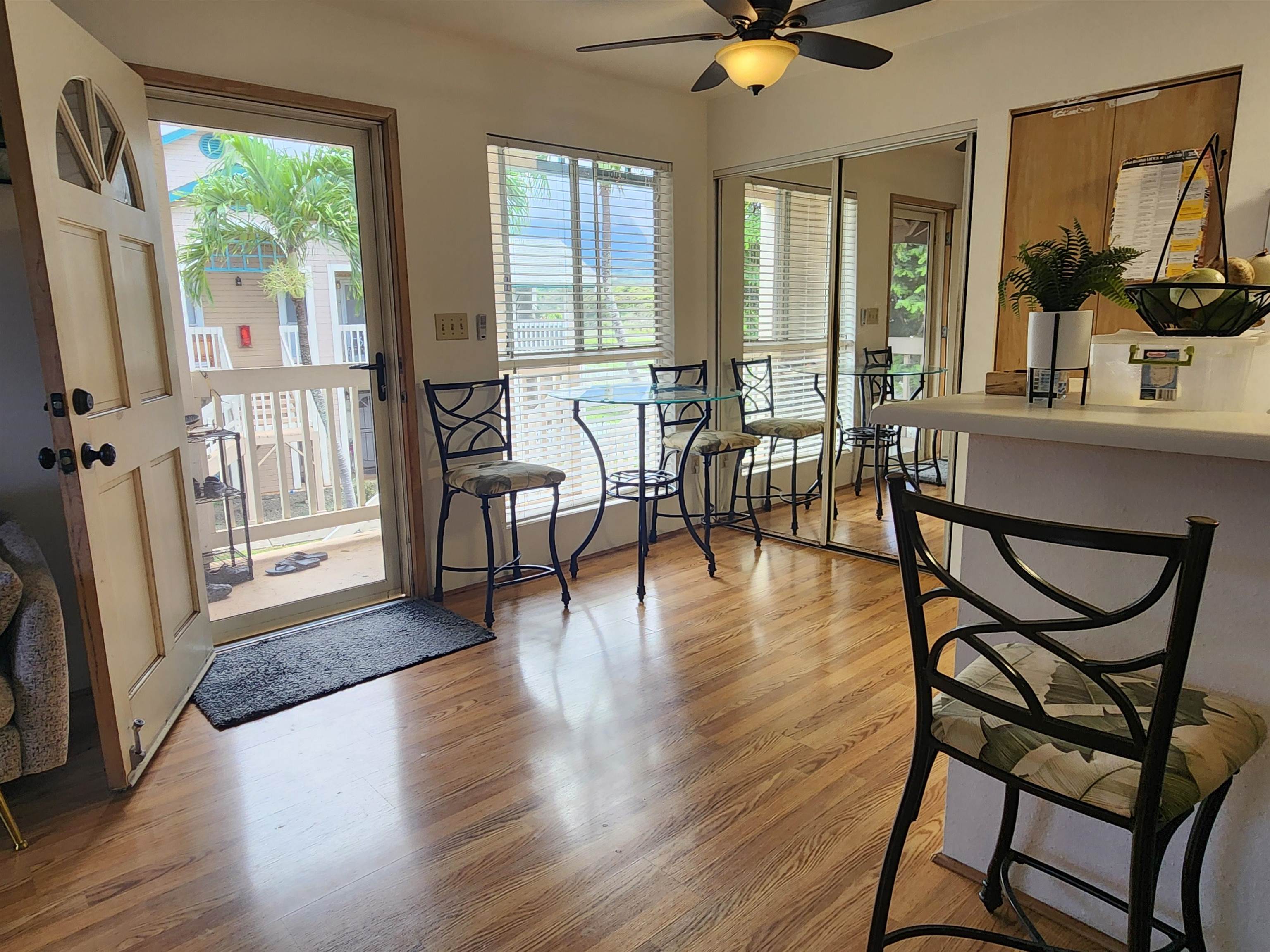 a view of a livingroom with furniture window and wooden floor