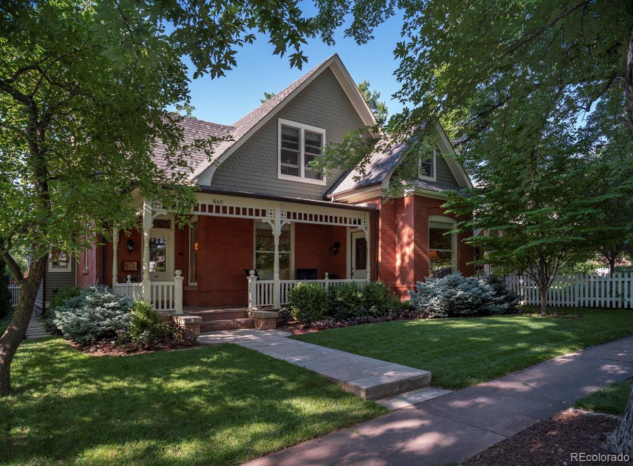 a front view of house with a garden