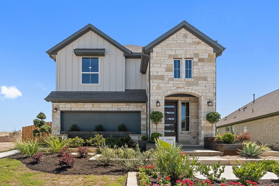 a front view of a house with yard