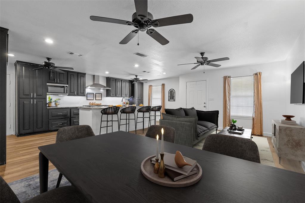 a living room with lots of furniture and kitchen view