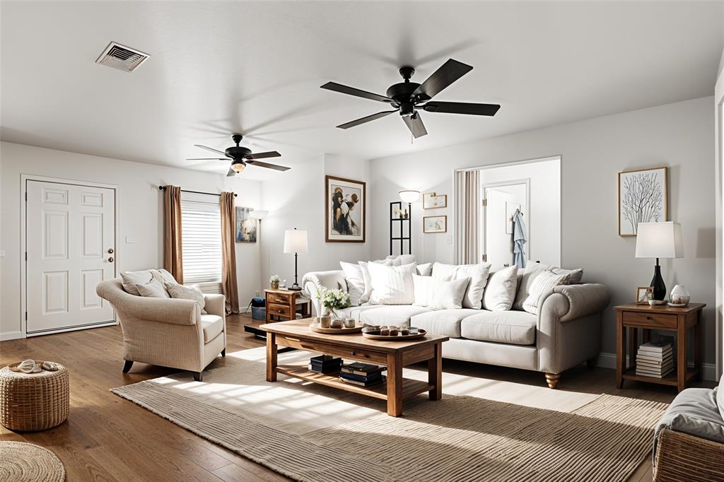 a living room with furniture and a ceiling fan