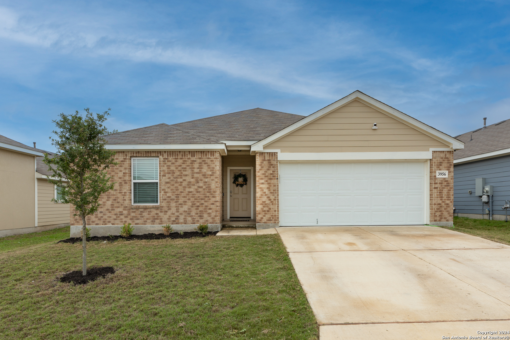 front view of a house and a yard