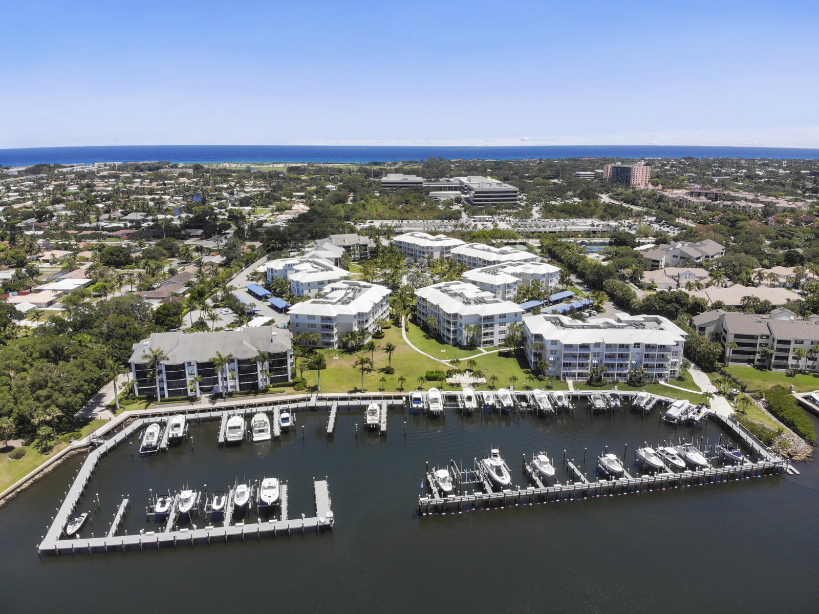 an aerial view of residential houses with city view