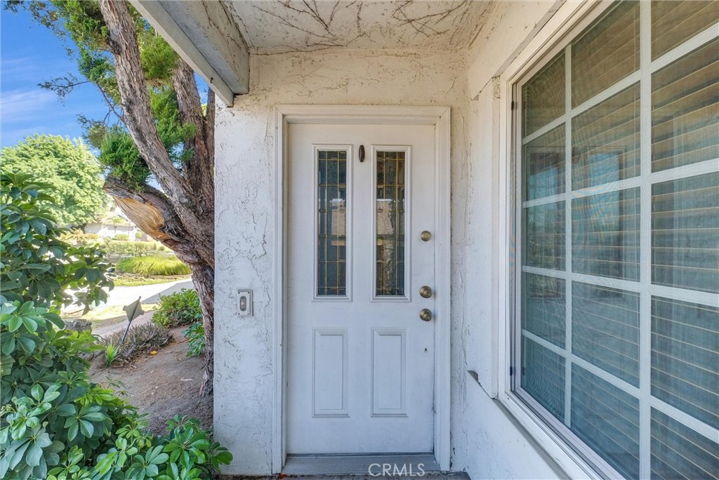 a view of a door and a window