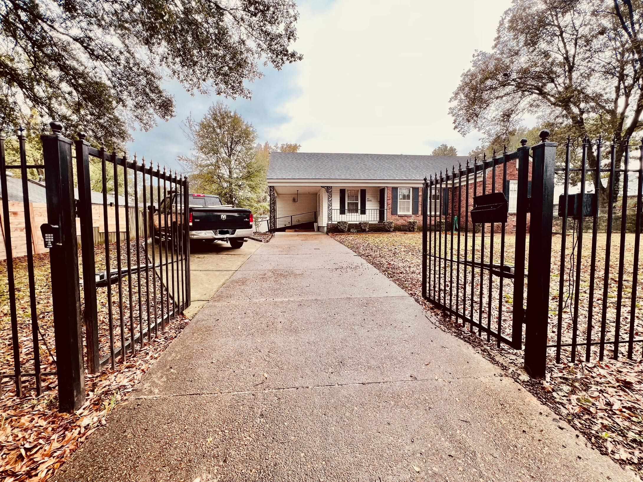 View of gate with a garage