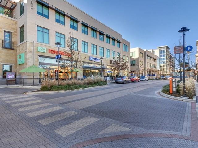 a city street lined with tall buildings