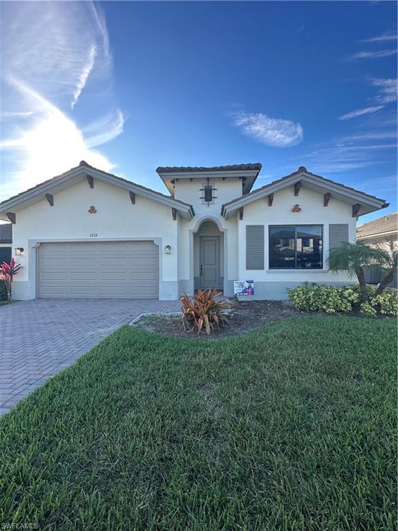 a front view of a house with a yard and porch