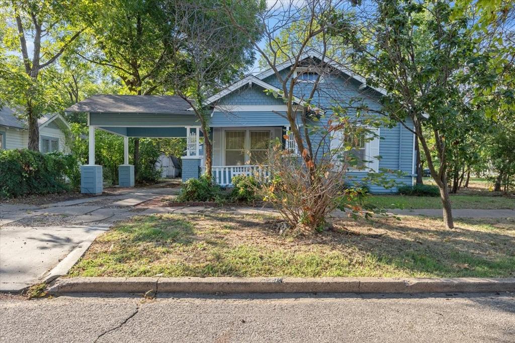 front view of a house with a small yard