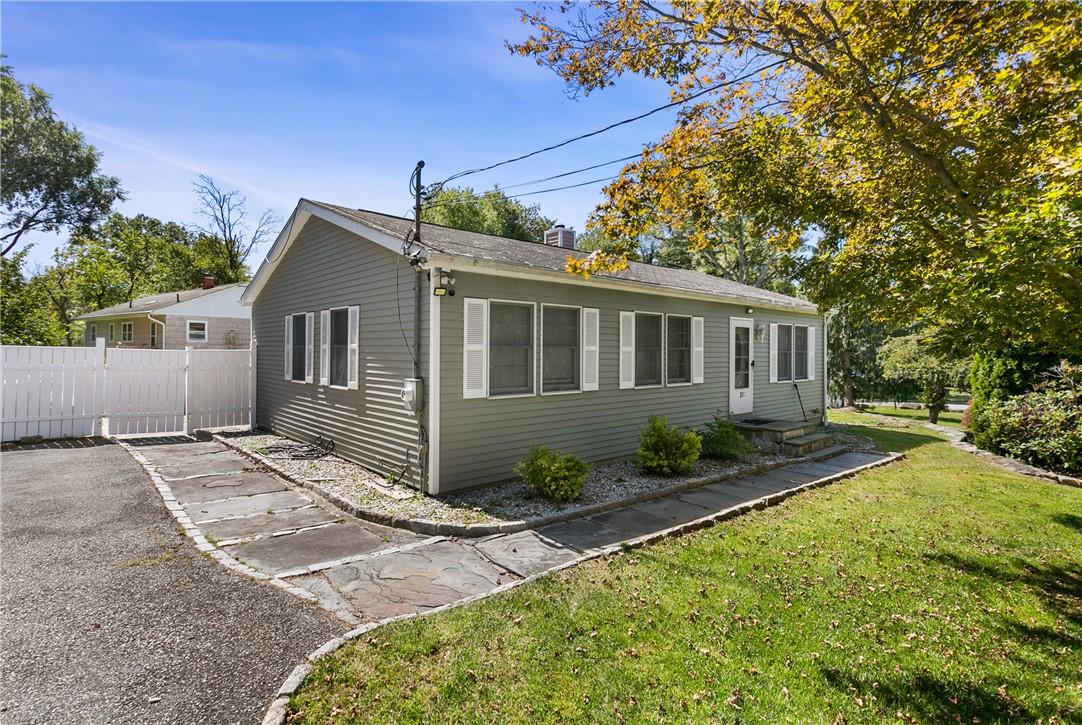 Single story home featuring a front yard