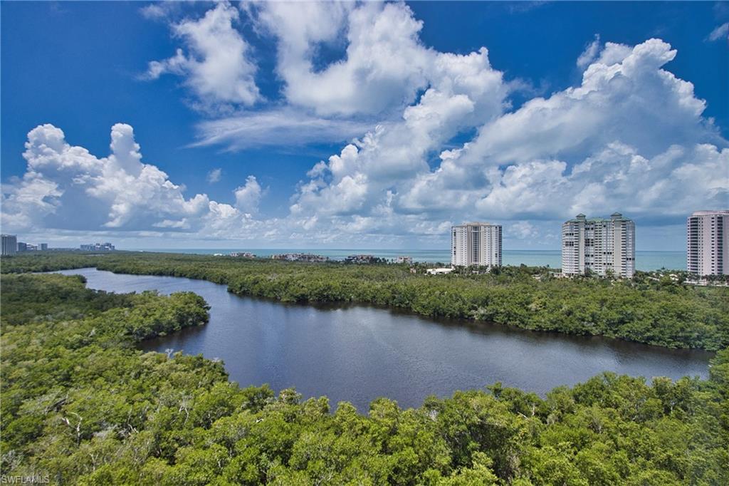 a view of a lake with a house in the background