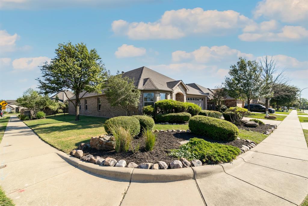 a view of a fountain in the backyard of house