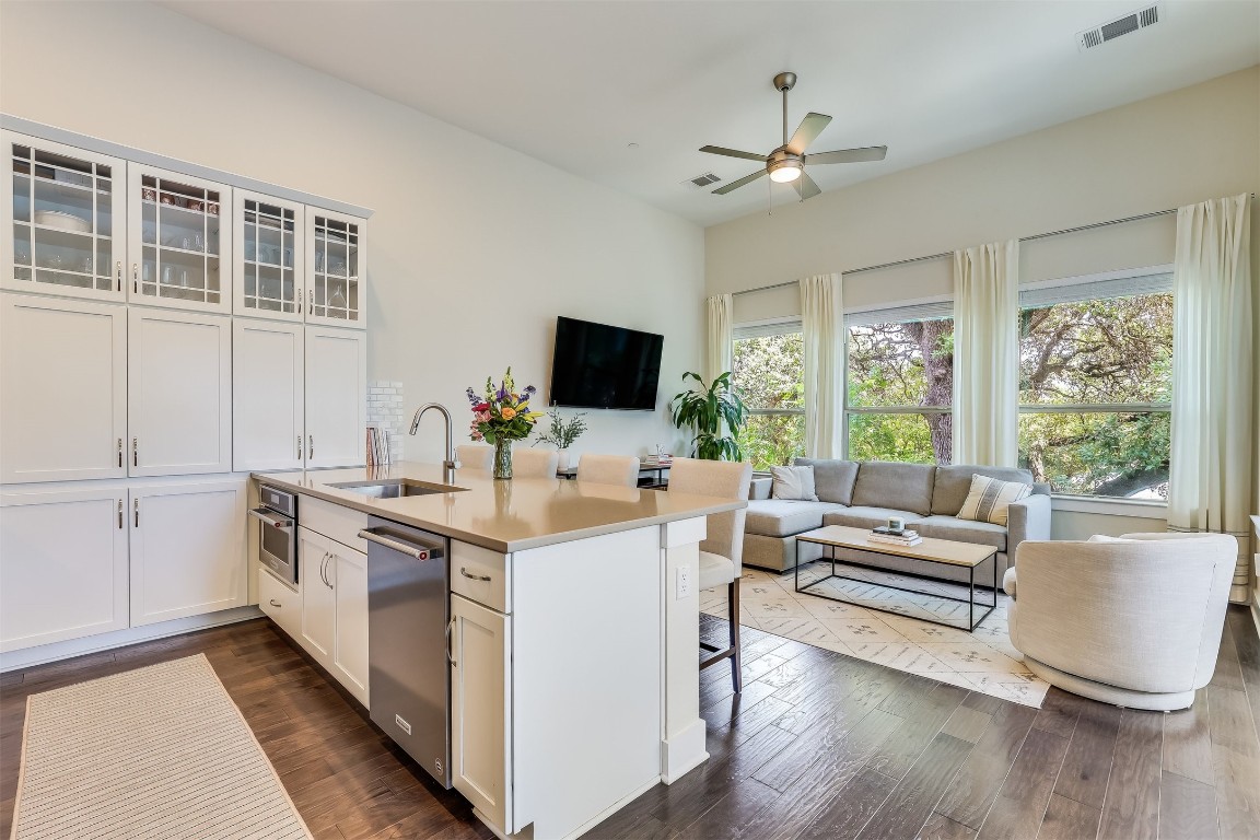 a kitchen with a stove a sink and a refrigerator