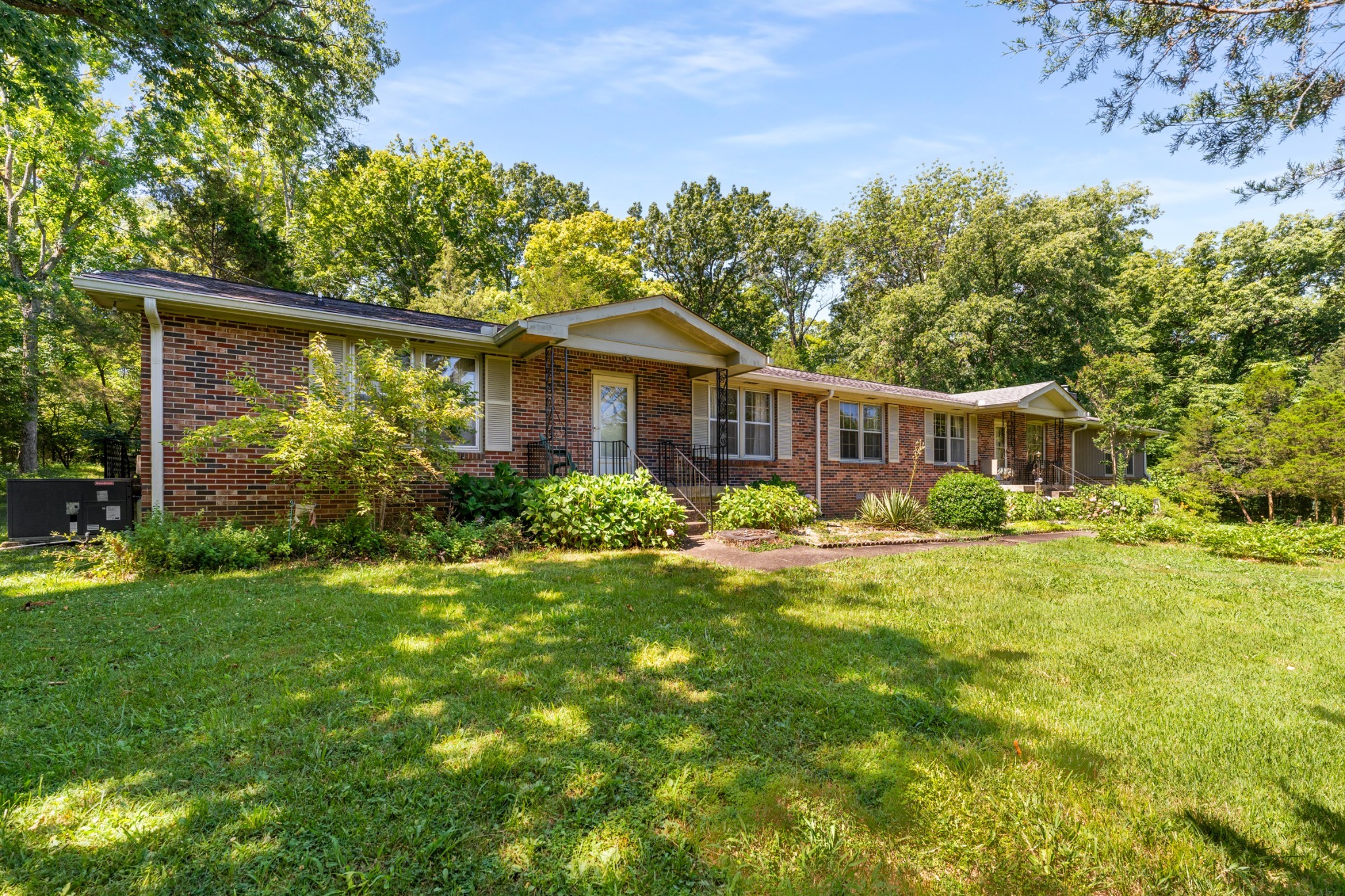 a front view of a house with garden