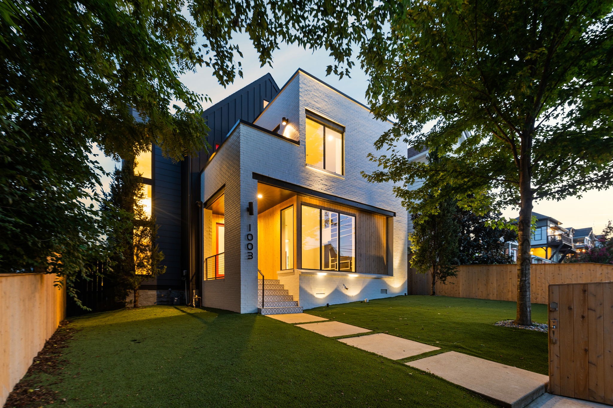 a front view of a house with a yard