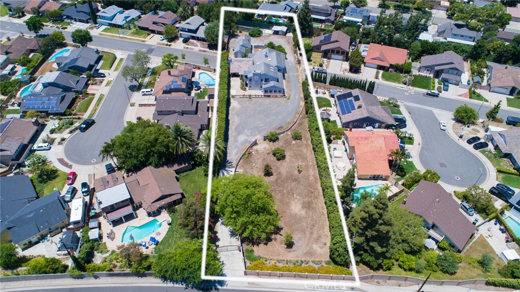 an aerial view of multiple houses with outdoor space