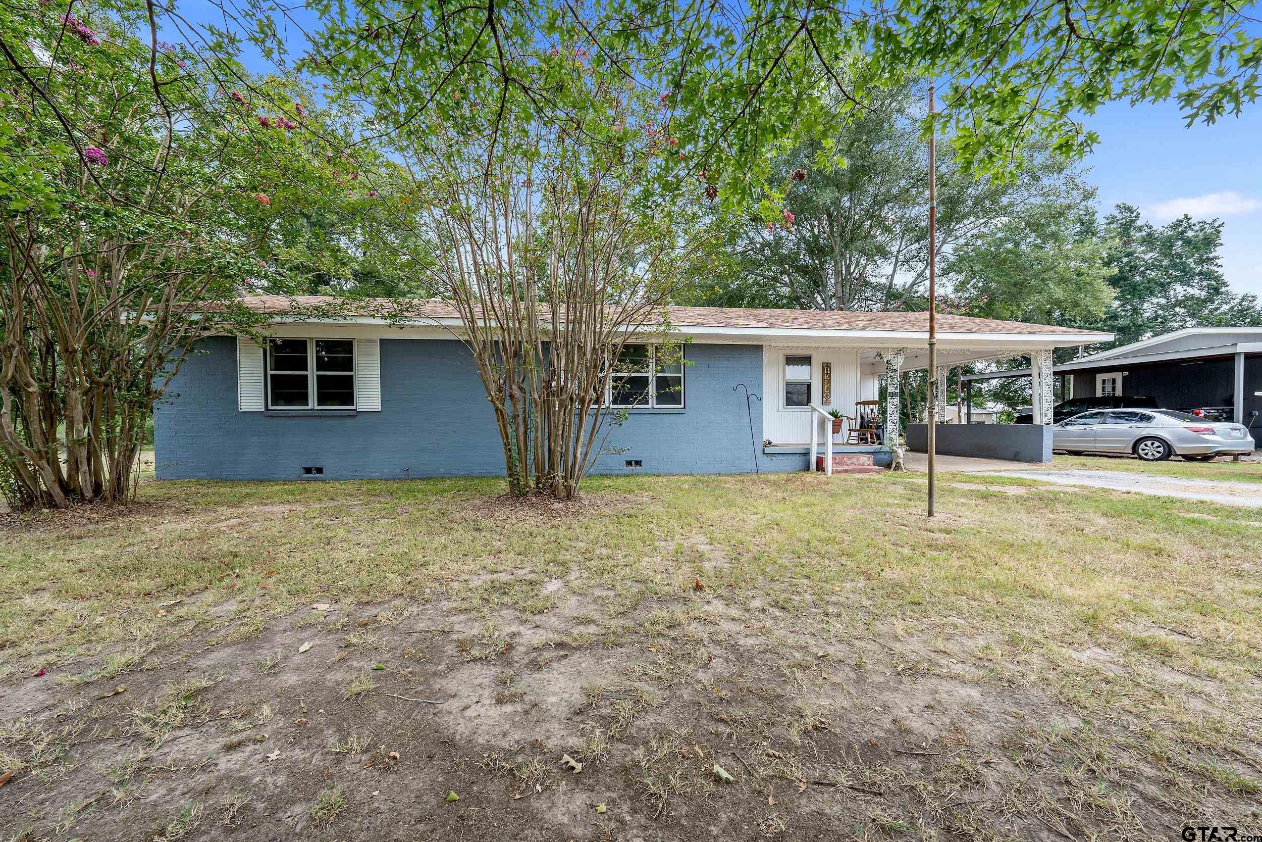 front view of a house with a yard