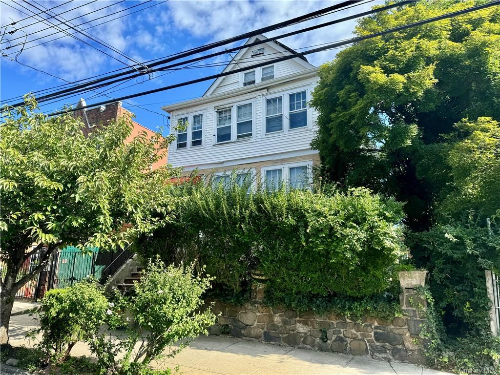 a view of a house with a tree