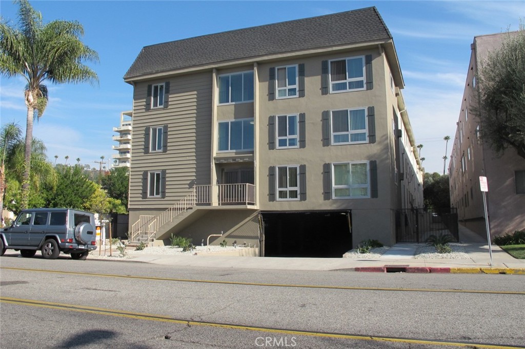 a front view of a building with street view