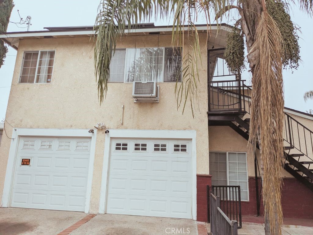 a front view of a house with parking