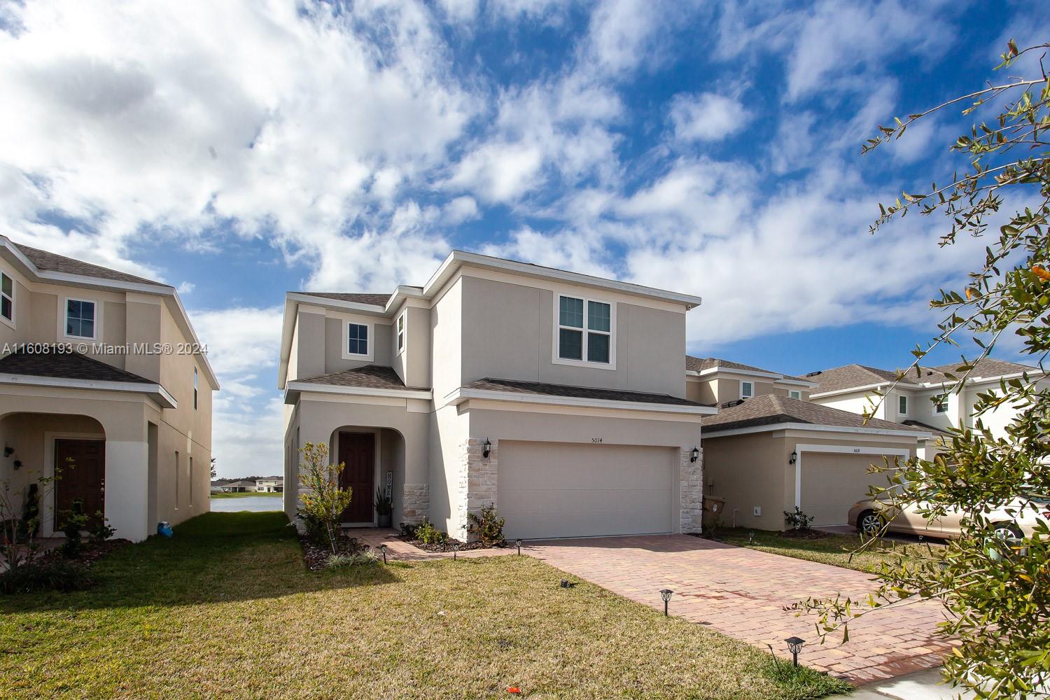 a view of house with yard and entertaining space