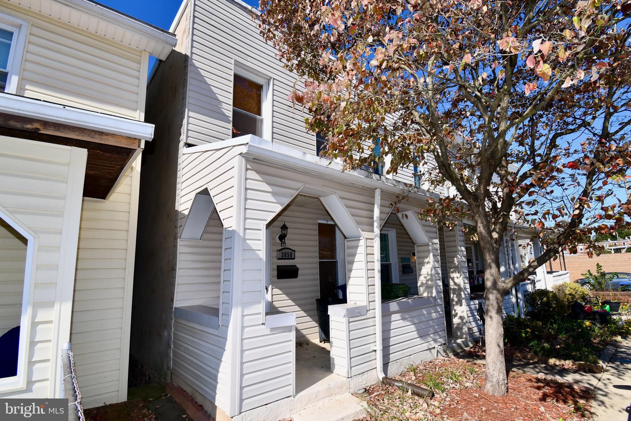 a view of a house with a tree