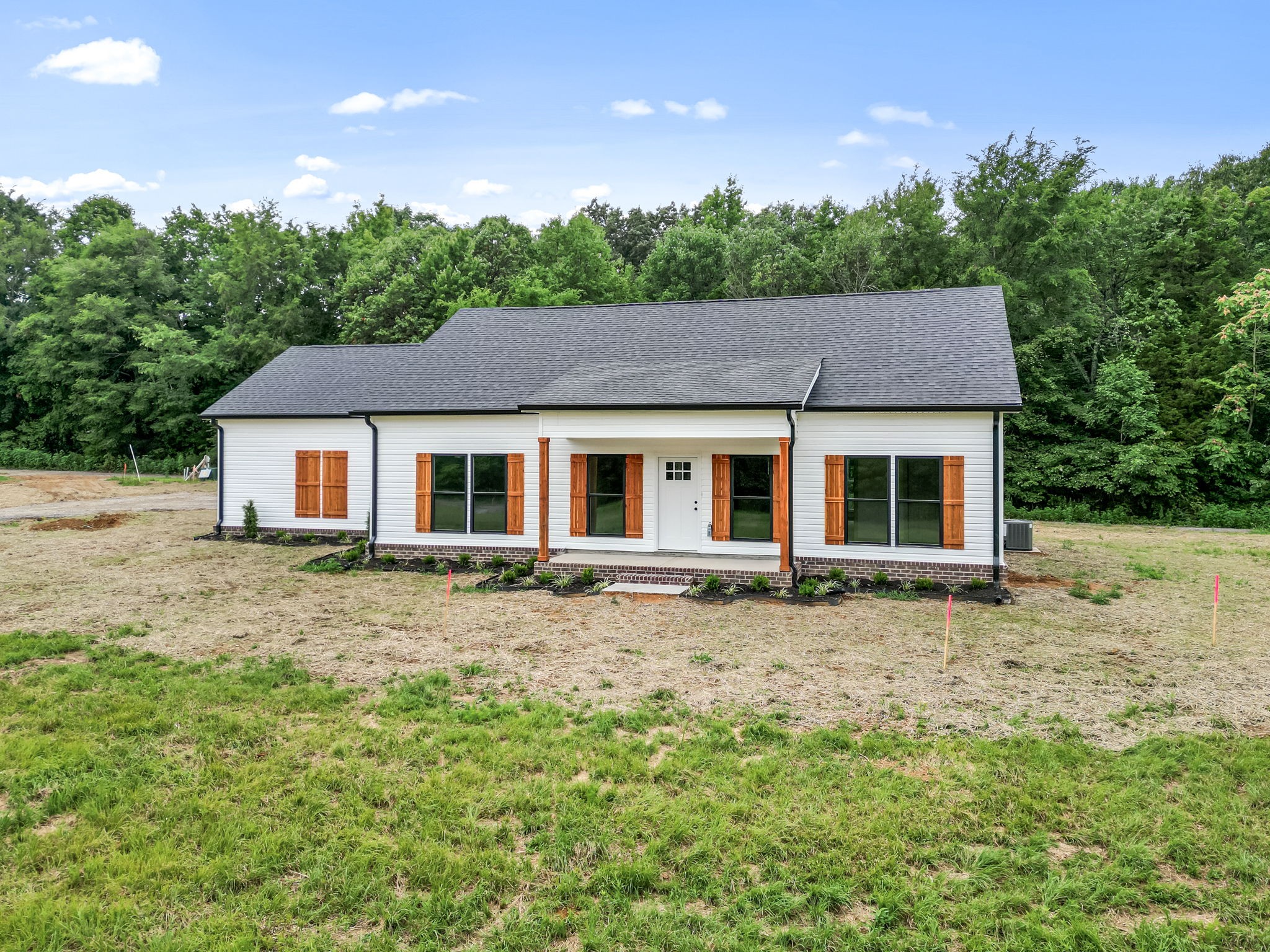 front view of a house with a yard