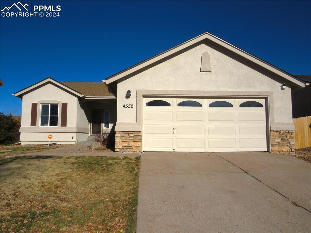 Ranch-style home with a garage