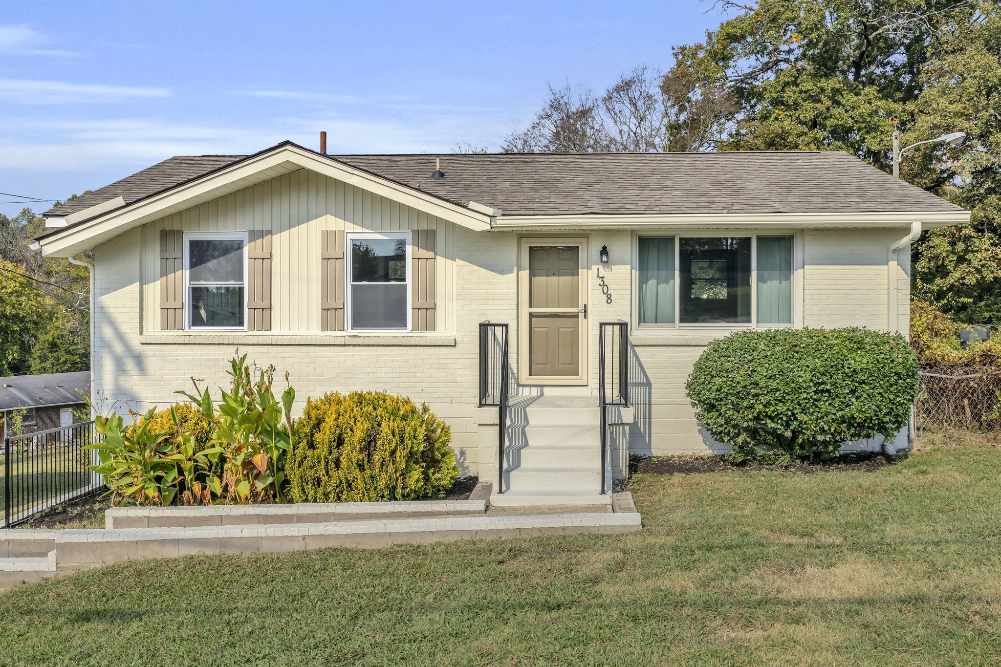 a front view of a house with garden