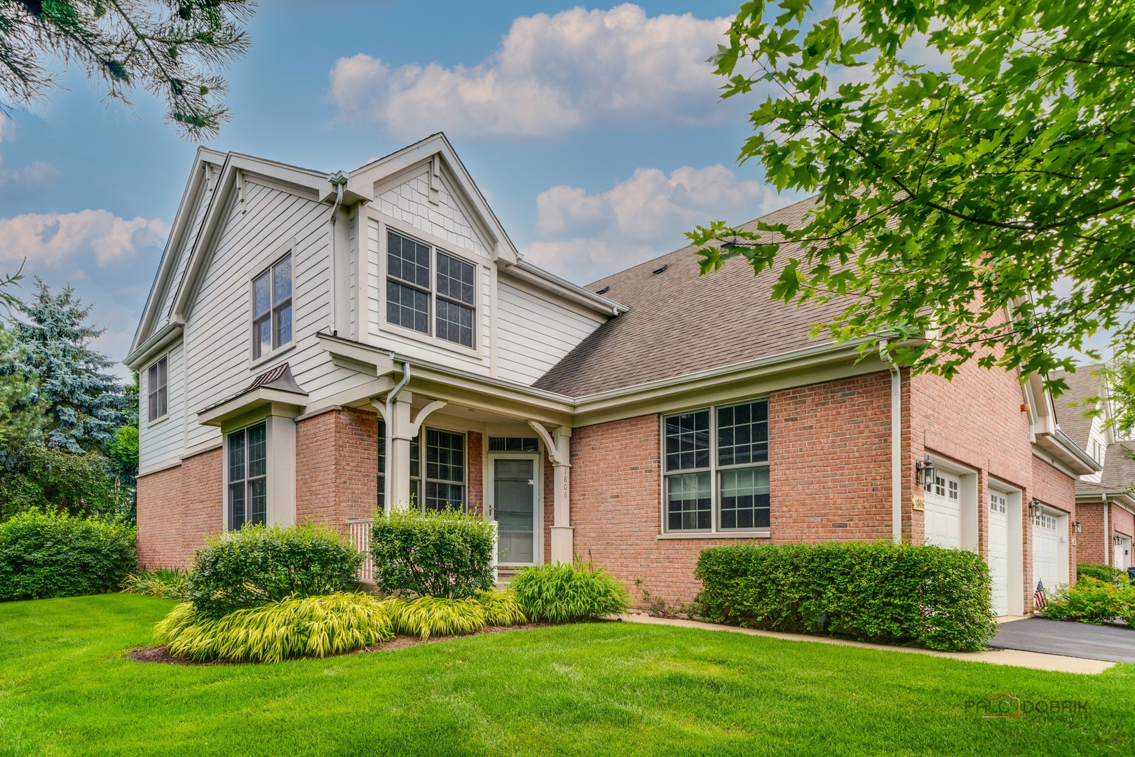 front view of a house with a yard