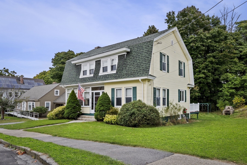 a front view of a house with a yard