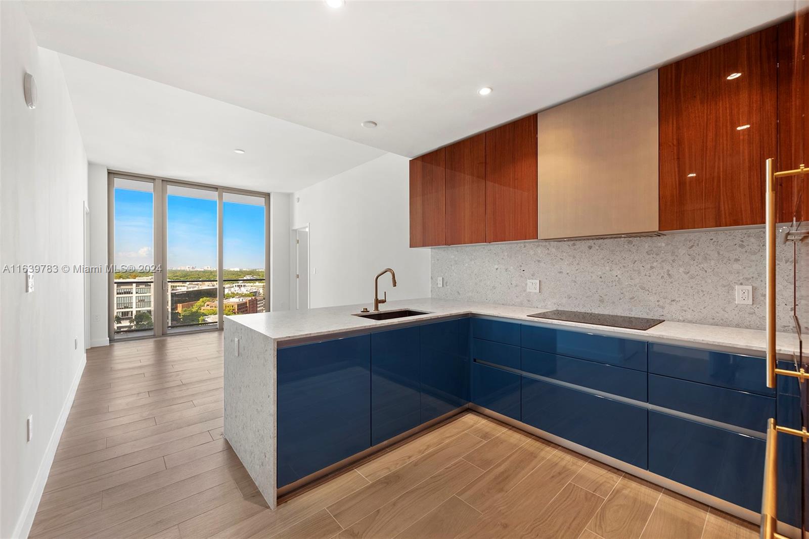 a kitchen with a sink and cabinets