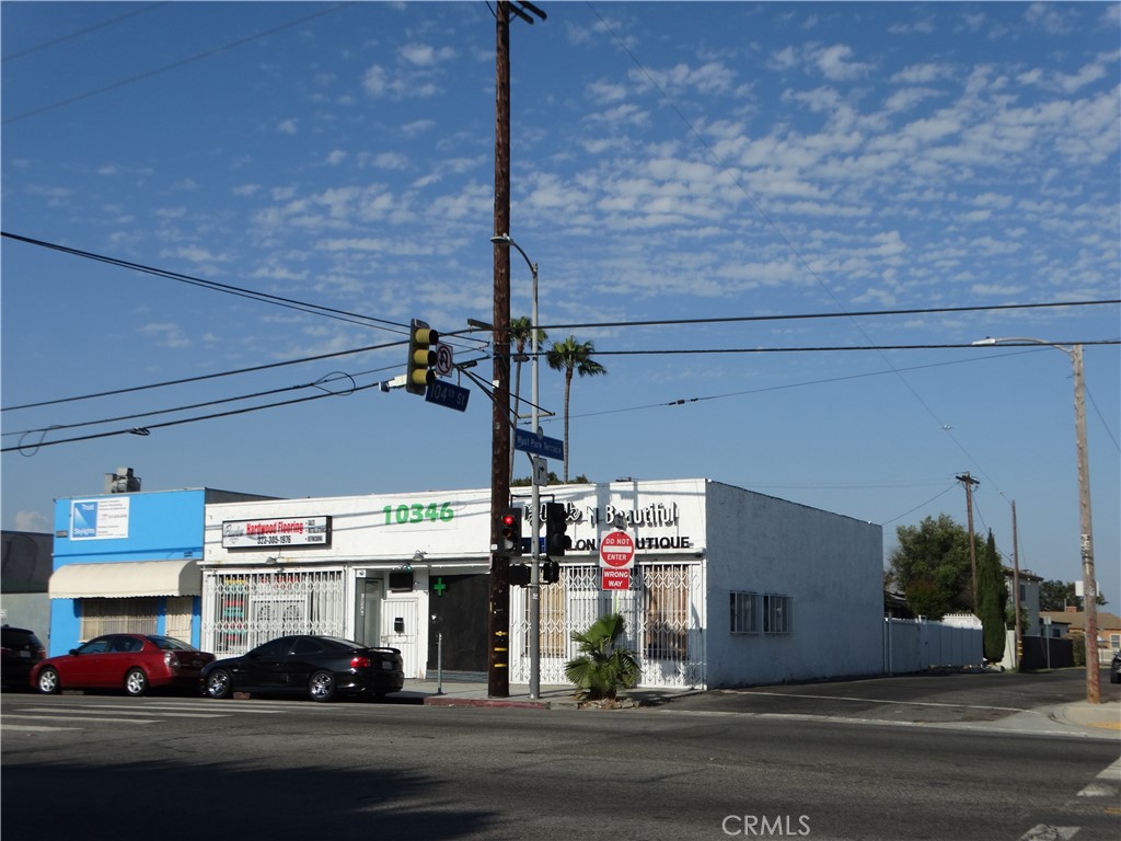 a view of a building with car parked