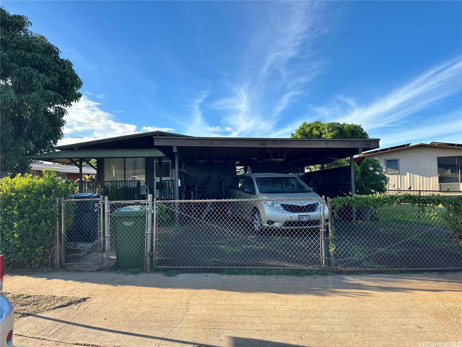 a view of a house with a cars park