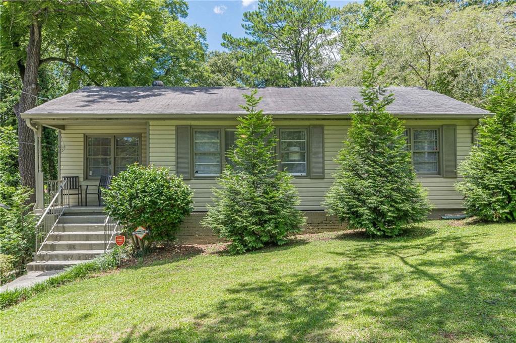 a front view of a house with garden