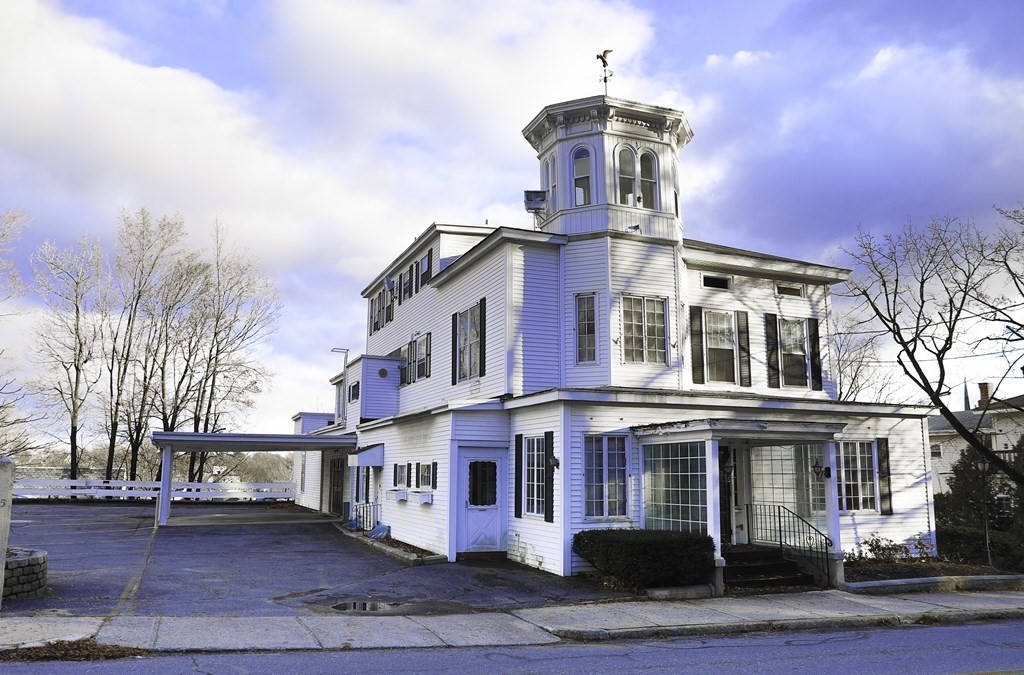 a front view of a building with street view