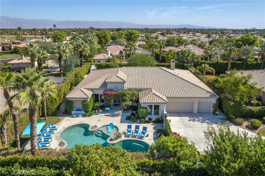 an aerial view of a house with a garden