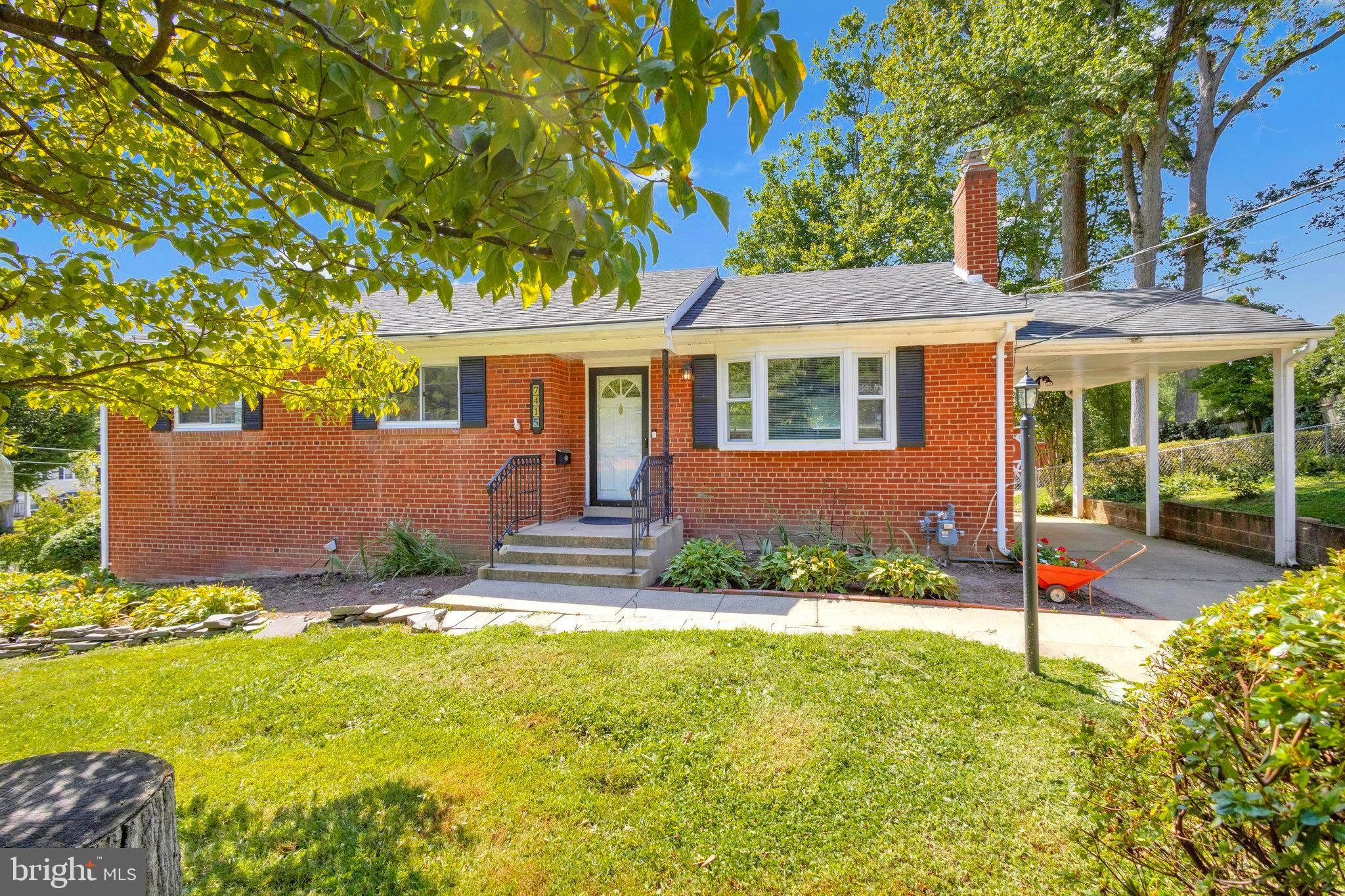 front view of a house with a yard