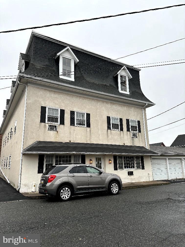 a car parked in front of a house