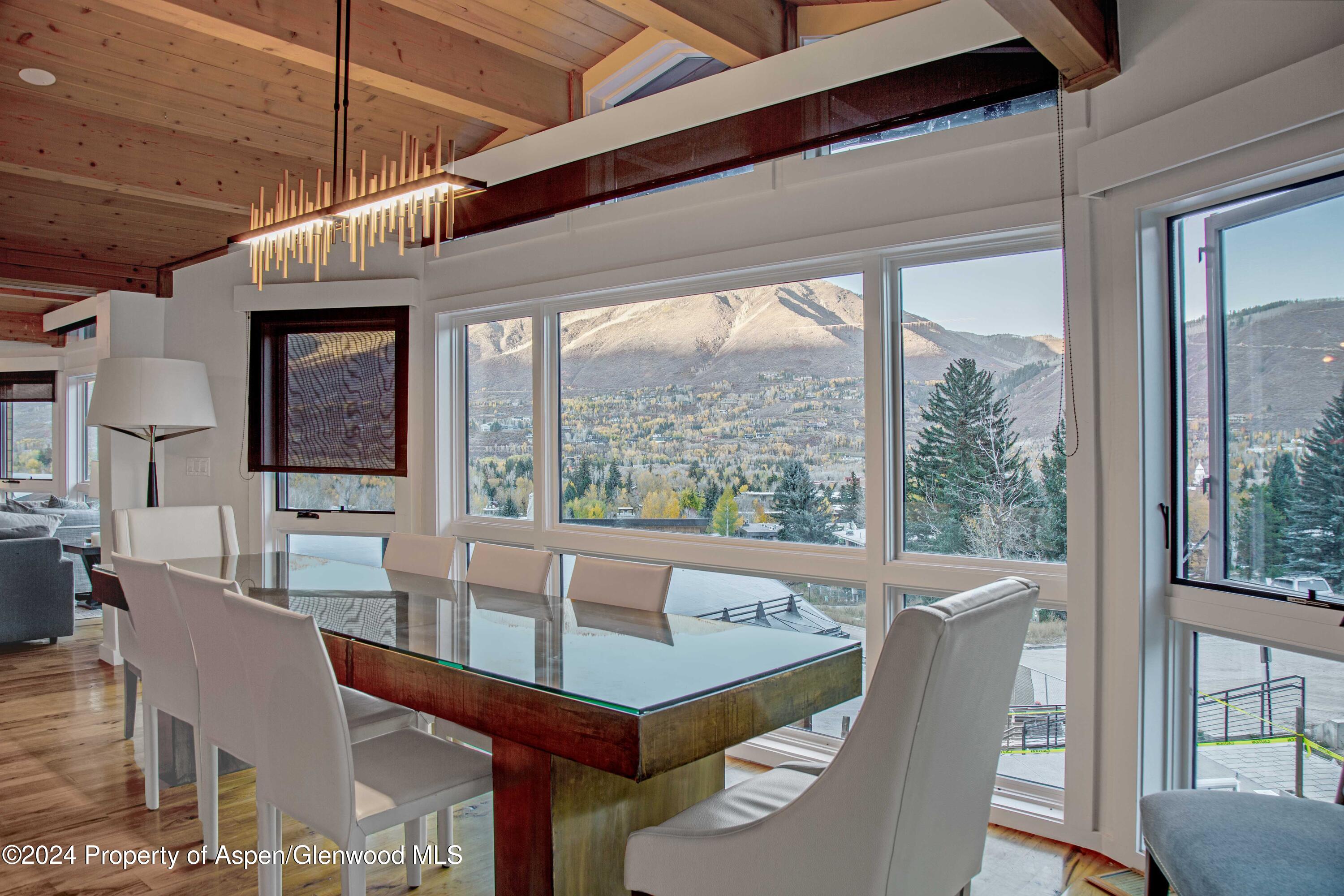 a view of a dining room with furniture window and outside view